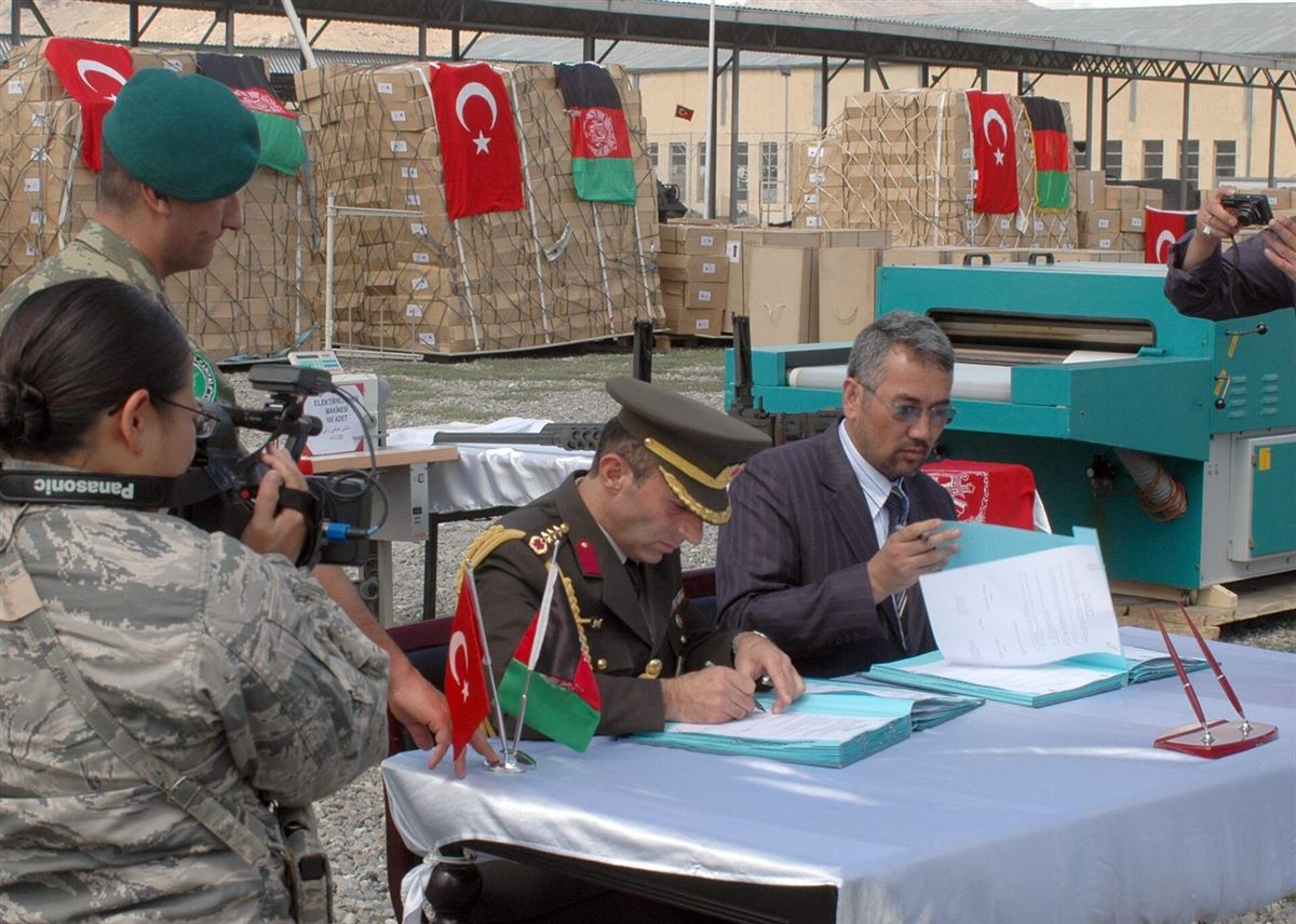A document being signed at a table