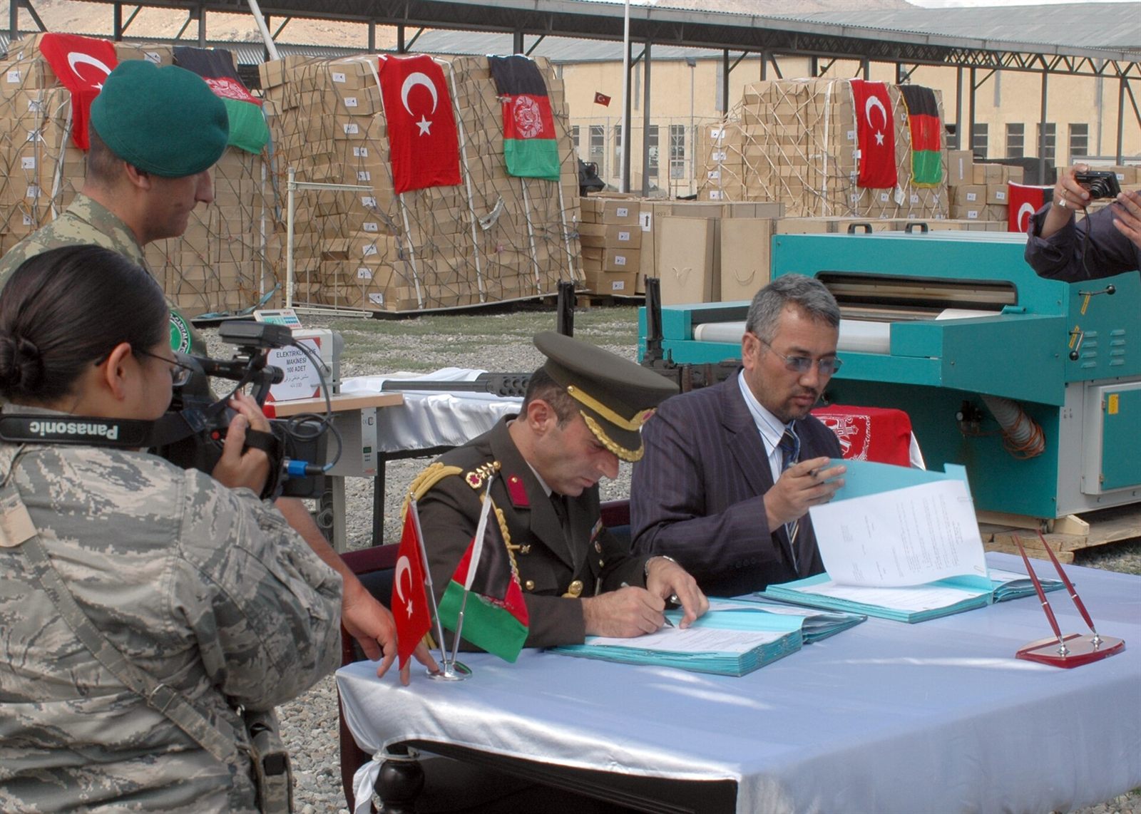 A document being signed at a table
